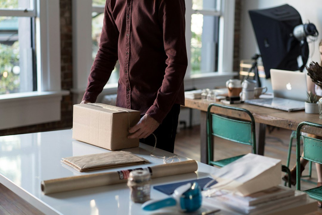 Laptop and parcel boxes on a small business workspace