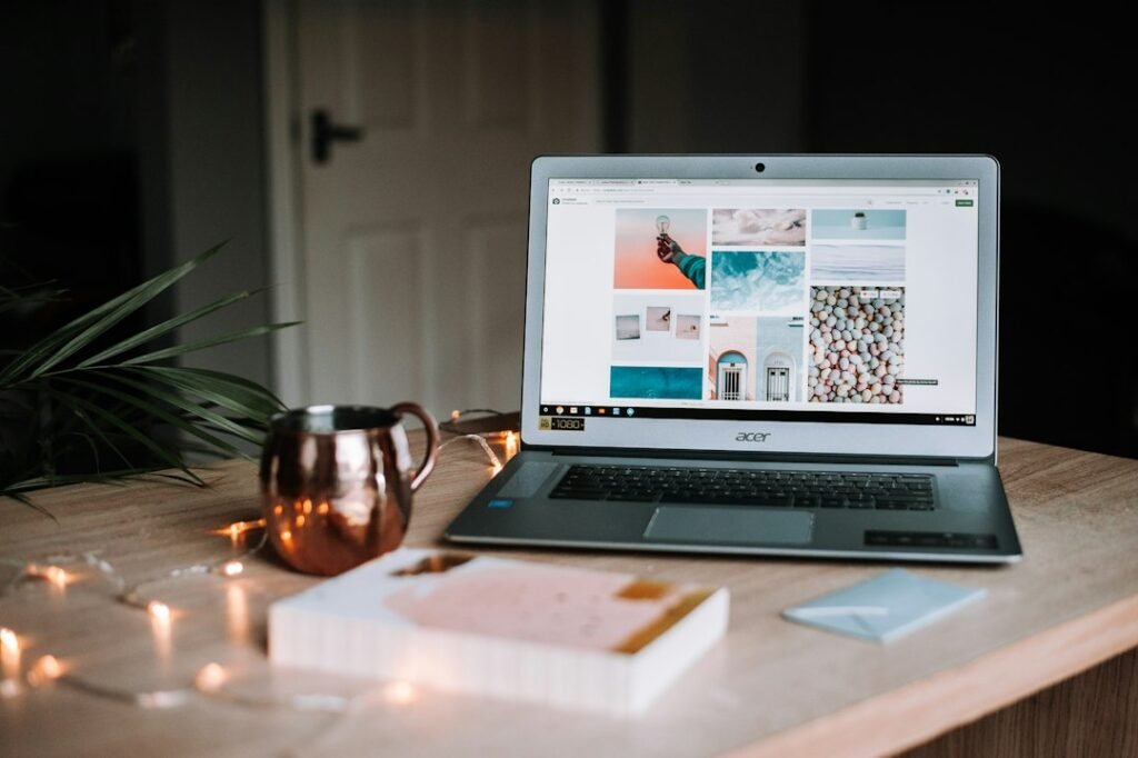 Laptop and notebook on a workspace for planning website content