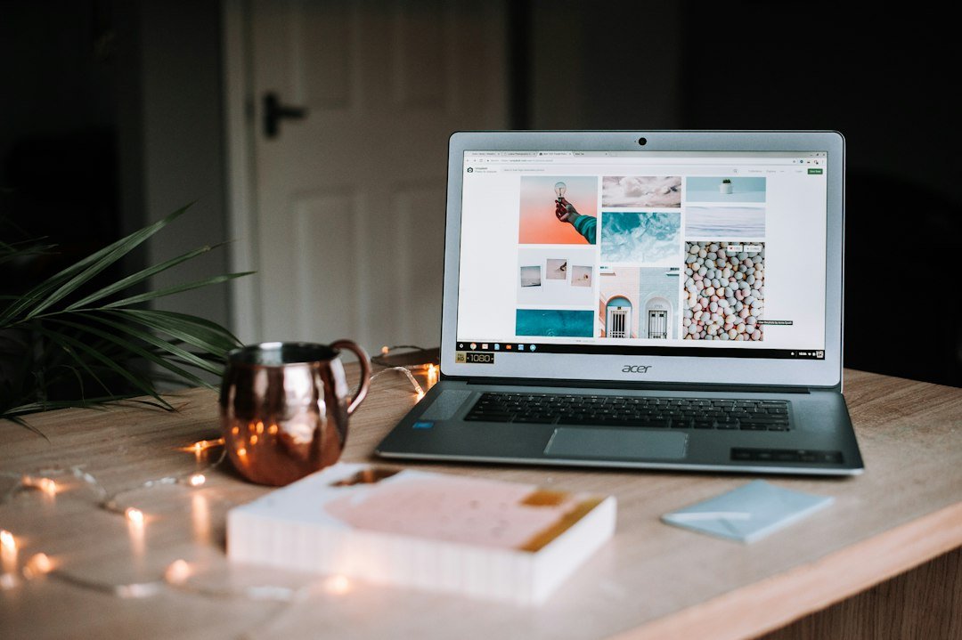 Laptop and notebook on a workspace for planning website content